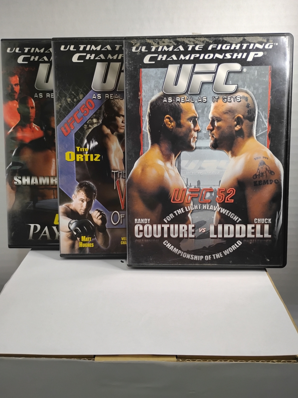 The UFC 40, 76, and 81 PPV DVD lot includes three DVDs featuring exciting mixed